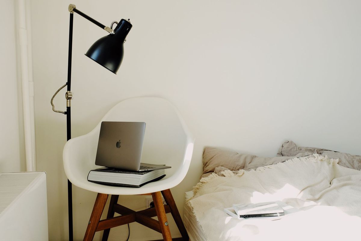 a bright cheerful study space with books and a laptop